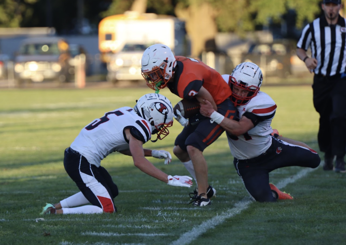 Senior Brock Schwarz takes down his Oakland-Craig opponent with the ball. In the Oakland-Craig game, Schwarz had 5 tackles. 